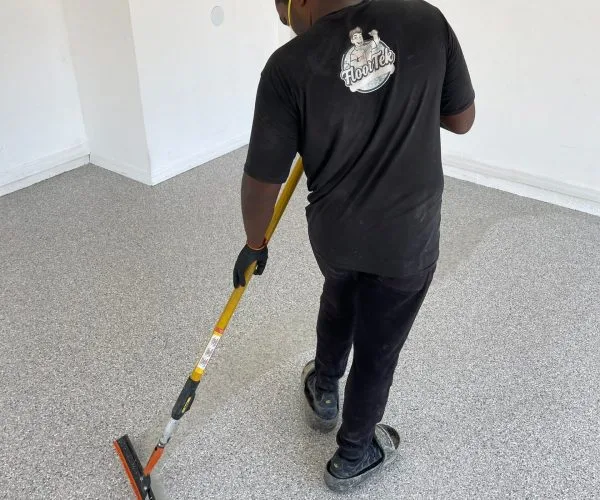 floortek worker applying coat